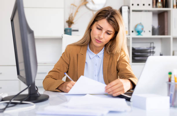 istock happy female manager working in white room 1313413563