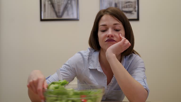 the bored woman does not want to eat