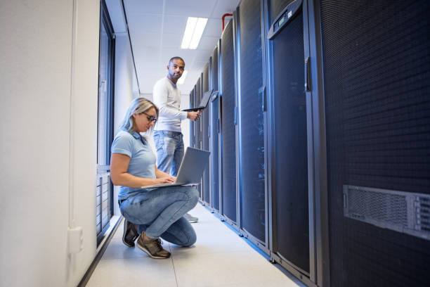 istock A duo of server room technicians at business reopening 1313414821