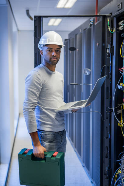 istock A black male server room technician working at business reopening 1313415025