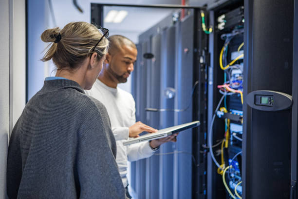 istock A duo of server room technicians at business reopening 1313415083