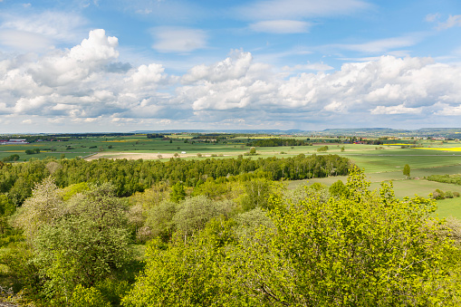 View over the countryside with fields and tree groves