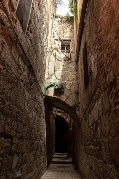 Old architecture of the residential buildings in the Muslim quarter near the exit from the Temple Mount - Chain Gate, in the old city of Jerusalem, in Israel