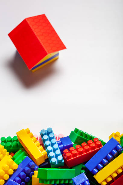 istock A colorful constructor set with the little house made from designer blocks close-up on the white background 1313419358