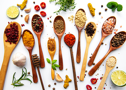 Various spices isolated on white background, top view