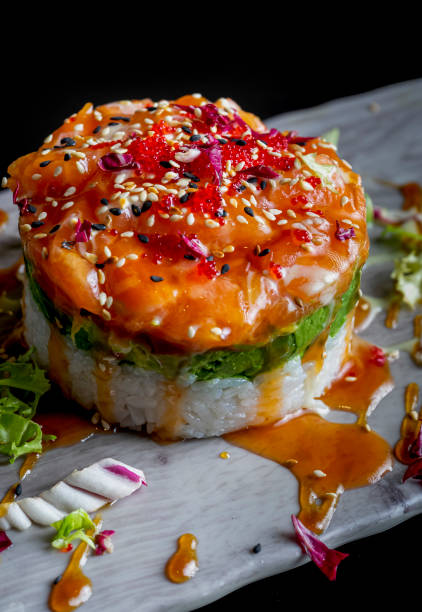 Delicious salmon and avocado tartare. Dark food