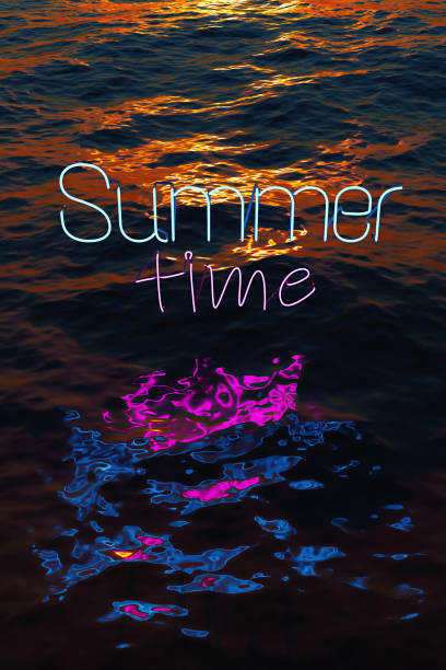 istock neon reflected in the sea with the words SUMMER TIME 1313424137