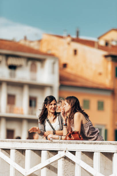 istock friends standing at the bridge in pisa 1313424247