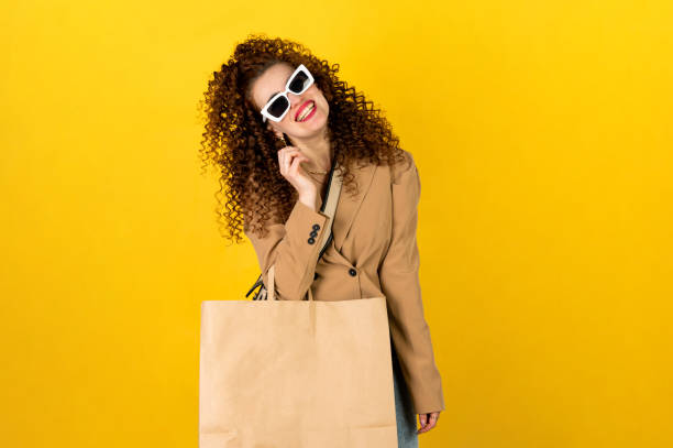 istock Girl with shopping bag smiling and posing 1313424988