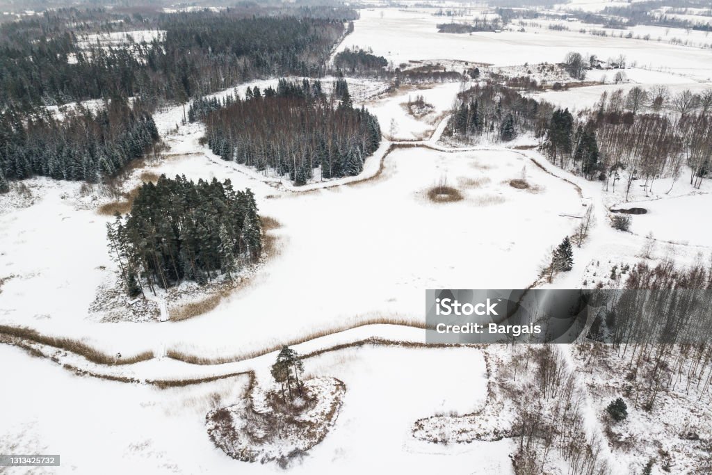 Aerial view of ponds with islands on a winter day Aerial view of ponds with islands on a winter day. Above Stock Photo