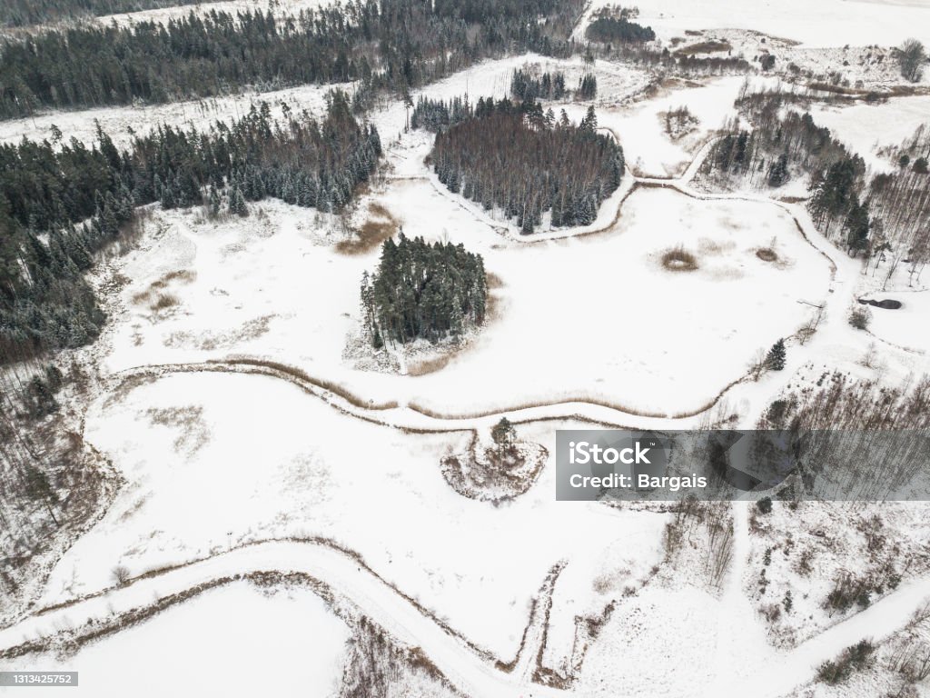 Aerial view of ponds with islands on a winter day Aerial view of ponds with islands on a winter day. Above Stock Photo