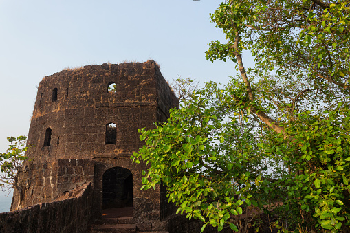 Sea side watch tower on the top of the fort, Jaigad, Maharashtra, India. Overlooks a bay formed where Shastri river enters the Arabian Sea