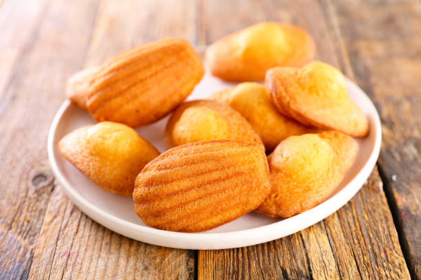 istock madeleine cake on wood background 1313425884