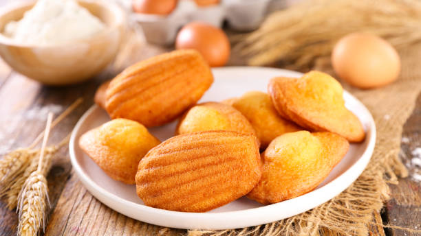 istock madeleine cake on wood background 1313425893