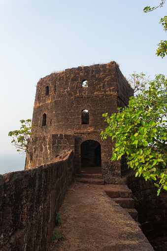 Sea side watch tower on the top of the fort, Jaigad, Maharashtra, India. Overlooks a bay formed where Shastri river enters the Arabian Sea