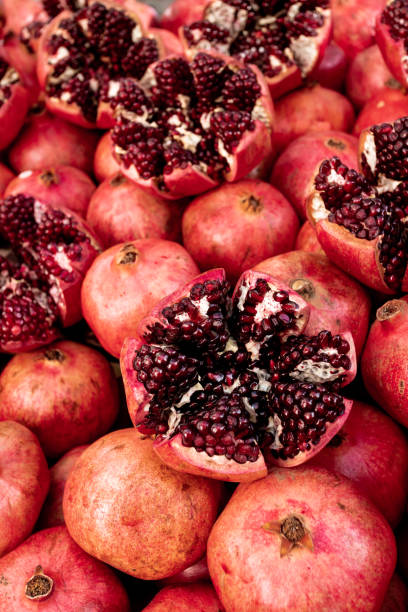 istock Cracked pomegranate. Ripe pomegranate close-up 1313426039