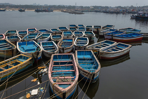 Small boats parked  at Mirkarwada jetty fish market, Ratnagiri, Maharashtra, India.