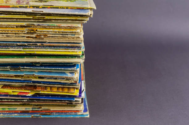 A collection of old comics and magazines on a gray background.