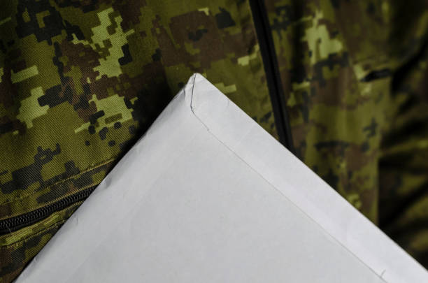 istock Large mailing bag on camouflage fabric. 1313427481