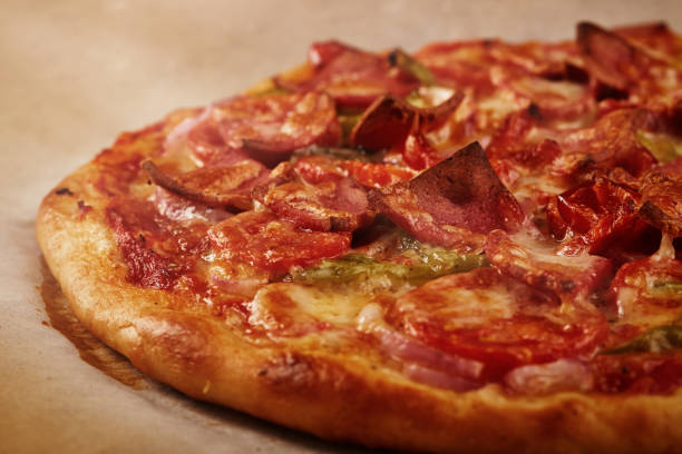 istock Tasty homemade pizza on rustic wooden table 1313428401