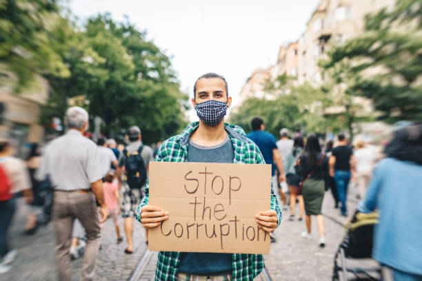 istock Young activist / protester against the corruption. Human rights and social issues concept. 1313428833