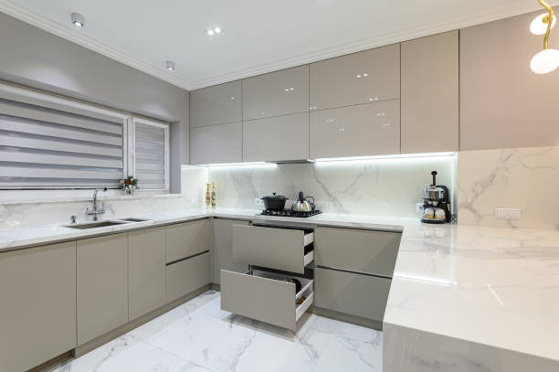 istock Open drawers at modern white kitchen furniture 1313430139