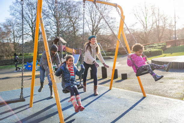 istock Family Fun on the Swings 1313430537