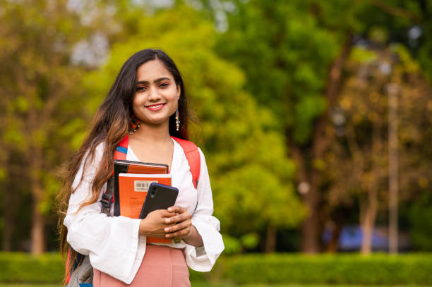 istock Young female student at park in campus 1313430853