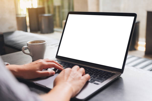 istock a woman using and typing on laptop computer with blank white desktop screen 1313433535