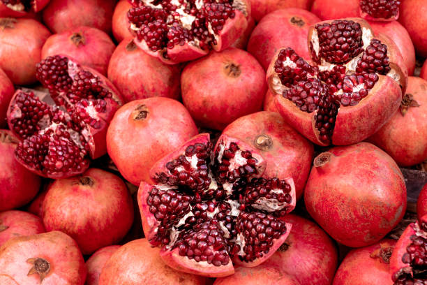 istock Cracked pomegranate. Ripe pomegranate close-up 1313433636