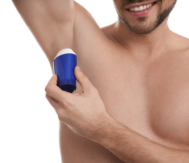 istock Man applying deodorant isolated on white, closeup 1313436144