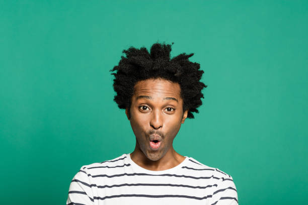 istock Headshot of surprised afro american man 1313436284