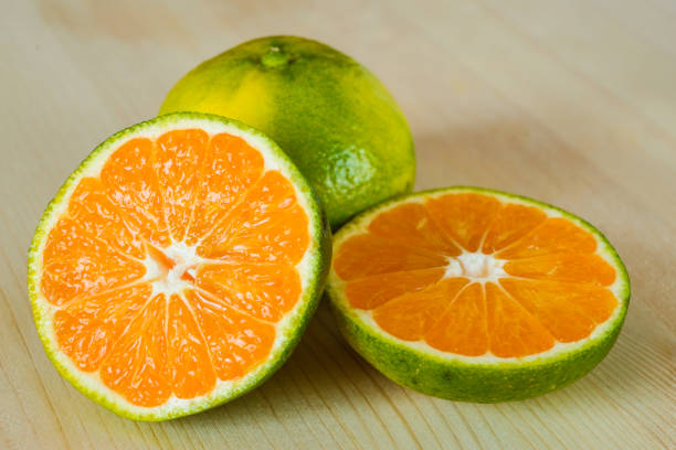 Cut oranges and white background