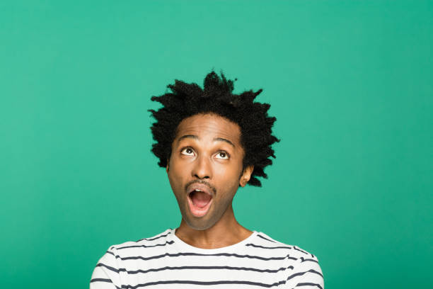 istock Headshot of surprised afro american man 1313436364