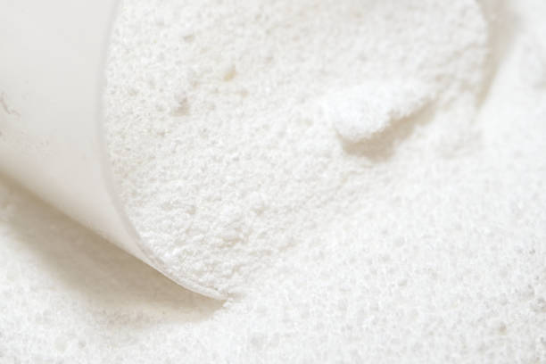istock Laundry detergent powder for washing clothes. Bright white with scoop. 1313438011