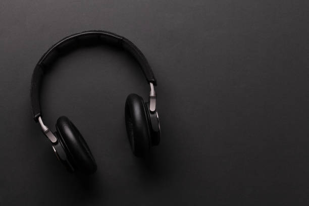 istock Wireless headphones on dark background 1313442462