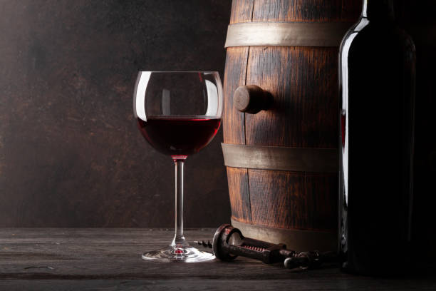 istock Decanter, red wine and old wooden barrel 1313442585