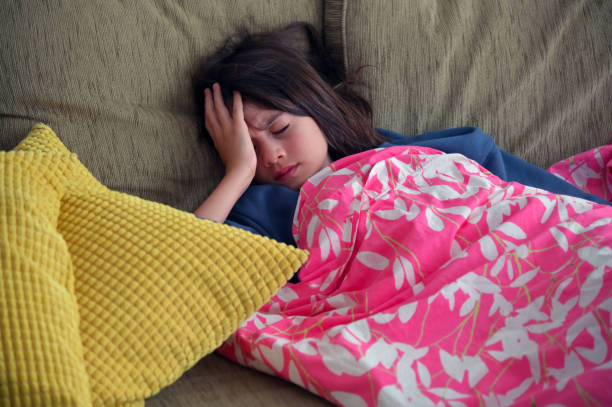 istock Young sick girl suffering from headache 1313445633