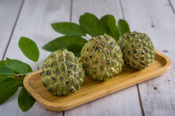 istock Sugar apple on wooden table. 1313446920