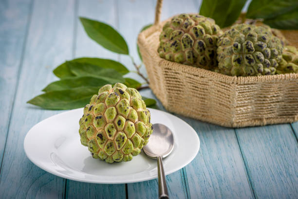 istock Sugar apple on wooden table. 1313446936