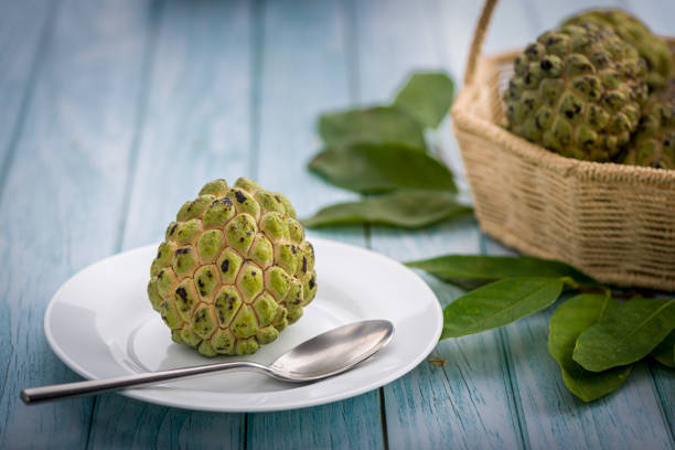 istock Sugar apple on wooden table. 1313446957