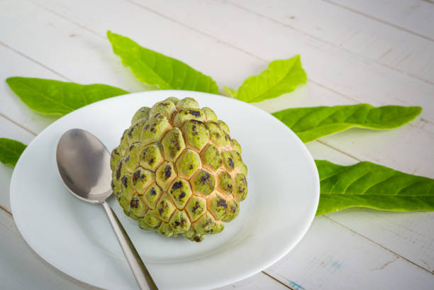 istock Sugar apple on wooden table. 1313446965