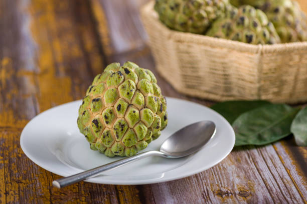 istock Sugar apple on wooden table. 1313446966