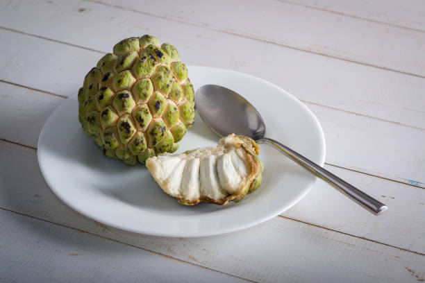 istock Sugar apple on wooden table. 1313446967