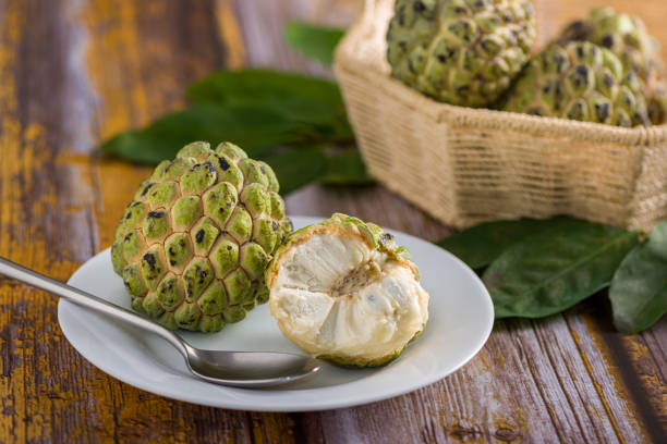 istock Sugar apple on wooden table. 1313446975