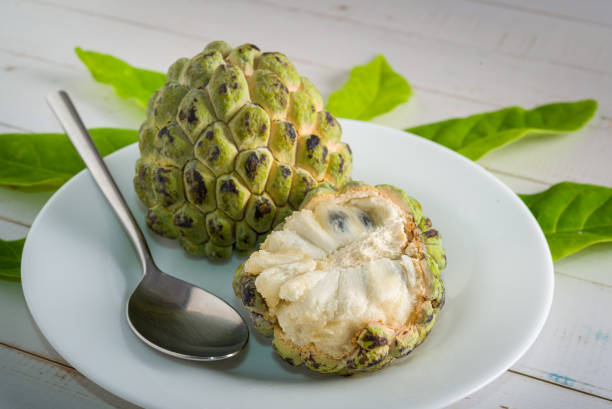 istock Sugar apple on wooden table. 1313446980