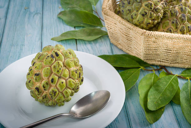 istock Sugar apple on wooden table. 1313446982