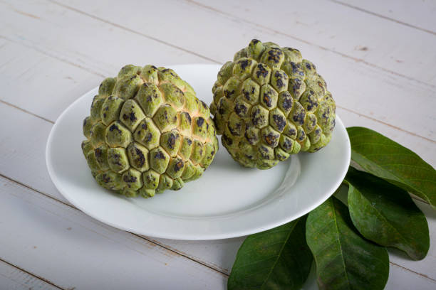 istock Sugar apple on wooden table. 1313447016