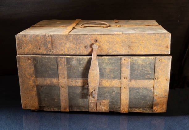 istock An old chest on a black background close-up. 1313447153
