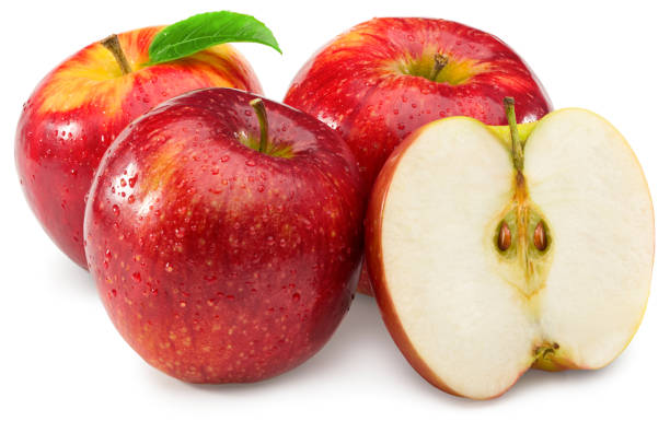 istock red apples with green leaf and half isolated on white background. clipping path 1313447351